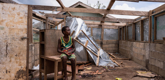 CH1802878 Noa from Vanuatu with his damaged school after TCs Kevin Judy