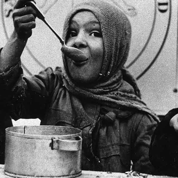 three children eating