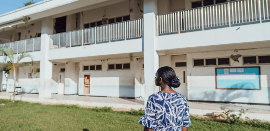 CH11268155 Aileen (18) observes her school, which was badly damaged in the recent Vanuatu earthquakes, with some classrooms reduced to rubble