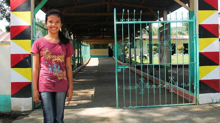 lady heart in front of her school